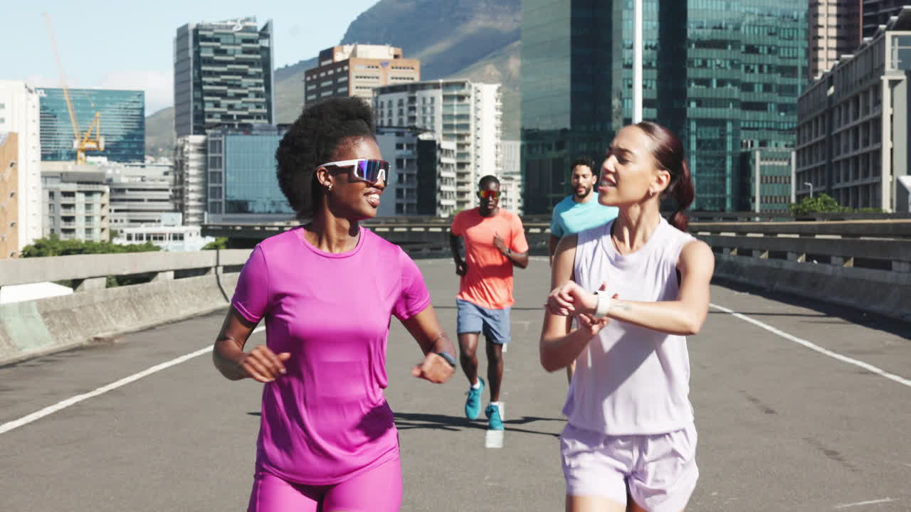 Diverse Group of Friends Jogging Together on a City Street