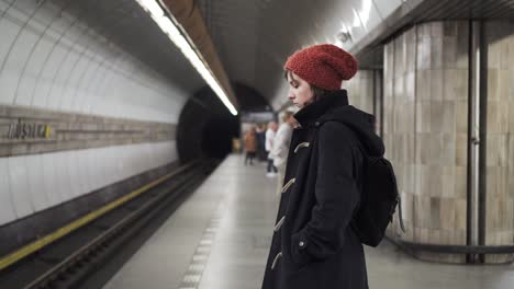 girl waiting for metro or subway in prague