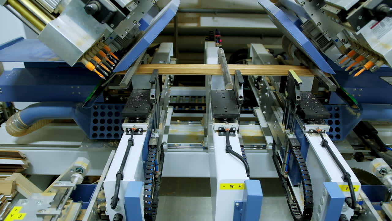 Wooden door manufacturing process. Woodworking machine for the production of parts of interior doors