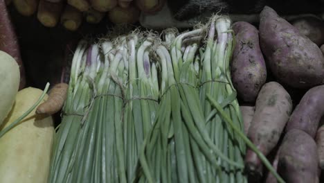 spring onions at vegetable store for sale at evening