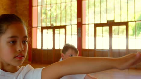 schoolkids performing yoga in elementary school 4k