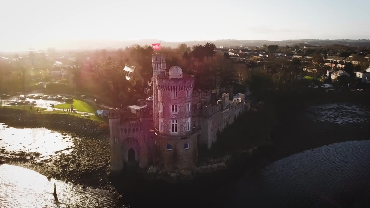 Black Rock castle aerial drone footage medium far with sun flares