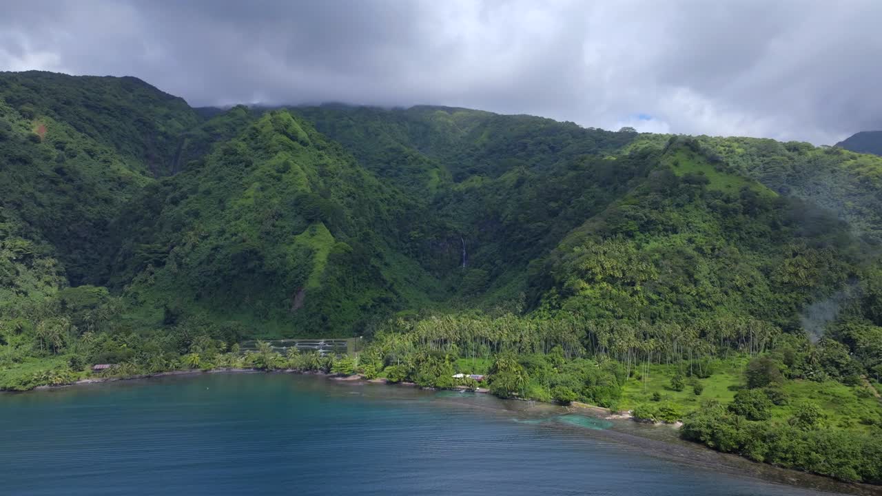 Remote Tautira Bay North Shore Tahiti island French Polynesia aerial drone Vallee de Teahupoo Taiarapu Papara Tavera Vaitepiha River village coastline South Pacific Ocean backwards motion