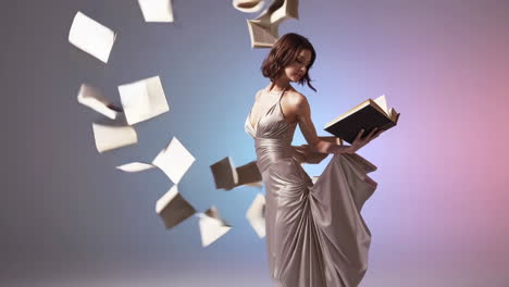 elegant woman floating with books and pages
