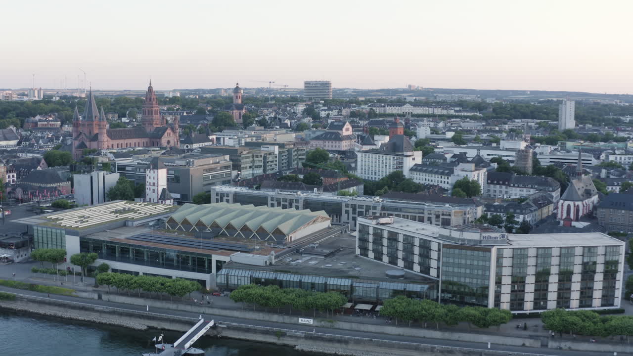 Aerial circling Drone View of Mainz dom, Rheingoldhalle, river rhine and Cityscape at Sunset Germany 4k