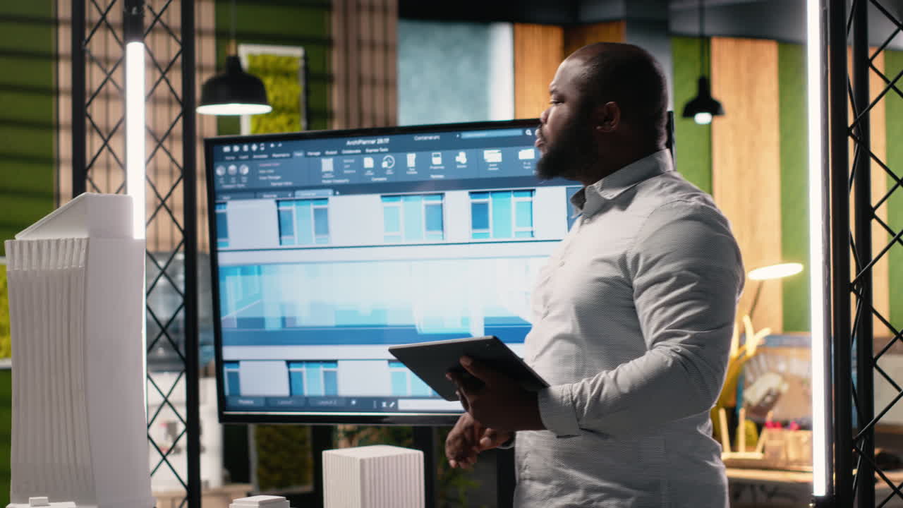 Vertical Video African american male developer studies zoning regulations for site preparation