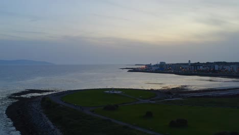 Captivating-blue-hour-sinking-aerial-over-Galway-Bay