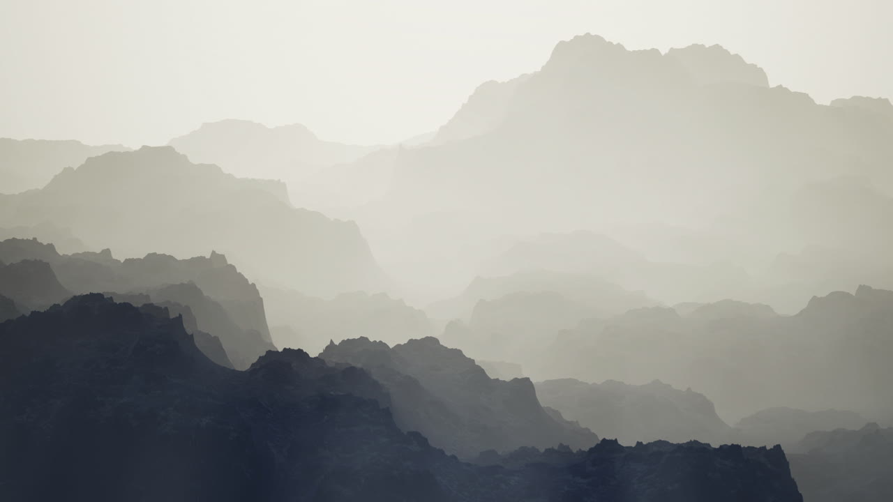 Layers of mountain ranges create a serene view during sunrise