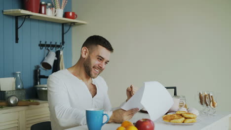 man enjoying breakfast in kitchen