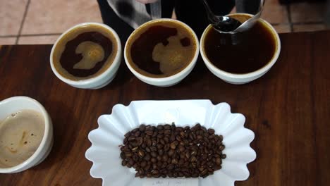 slow-motion-shot-of-tasting-coffee-removing-the-foam