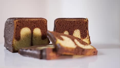 slice of marble cake on a white backdrop, selective focus