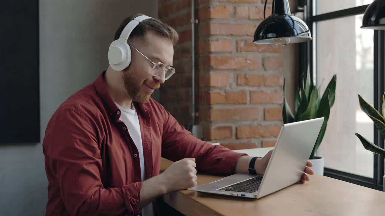 Man on a video call with a laptop