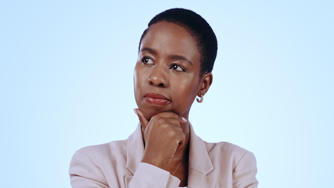 Black woman in studio, thinking