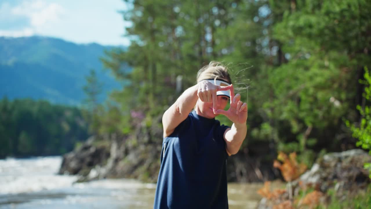 Woman Framing a Scenic View