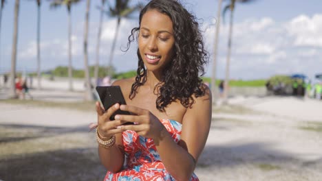 Cheerful-woman-speaking-on-phone-outside