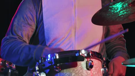 shark-costumed drummer on stage