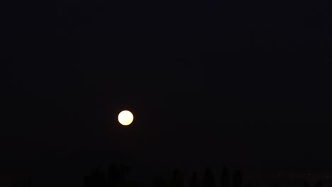 full moon over the city. super moon timelapse.