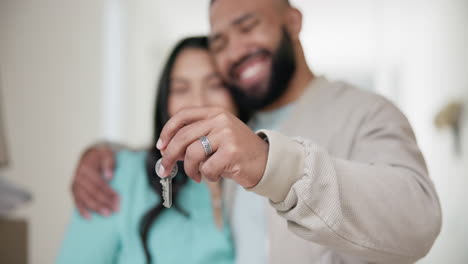 Hands,-couple-and-keys-in-new-home-for-moving