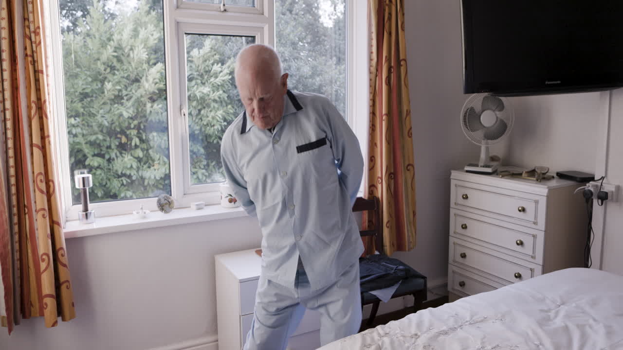 Elderly man in bedroom
