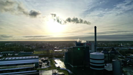 large green energy factory in latvia during a colorful sunrise in jelgava