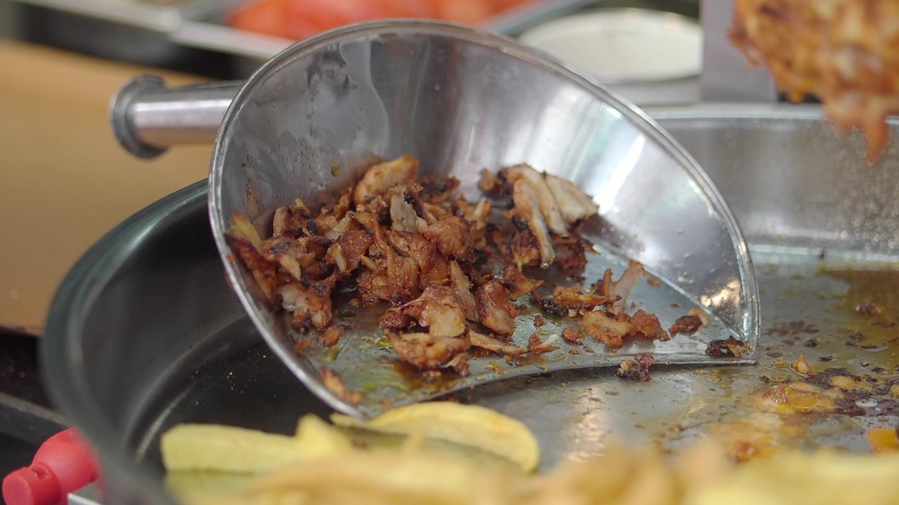 Golden Brown Shawarma Meat Freshly Sliced from Rotisserie