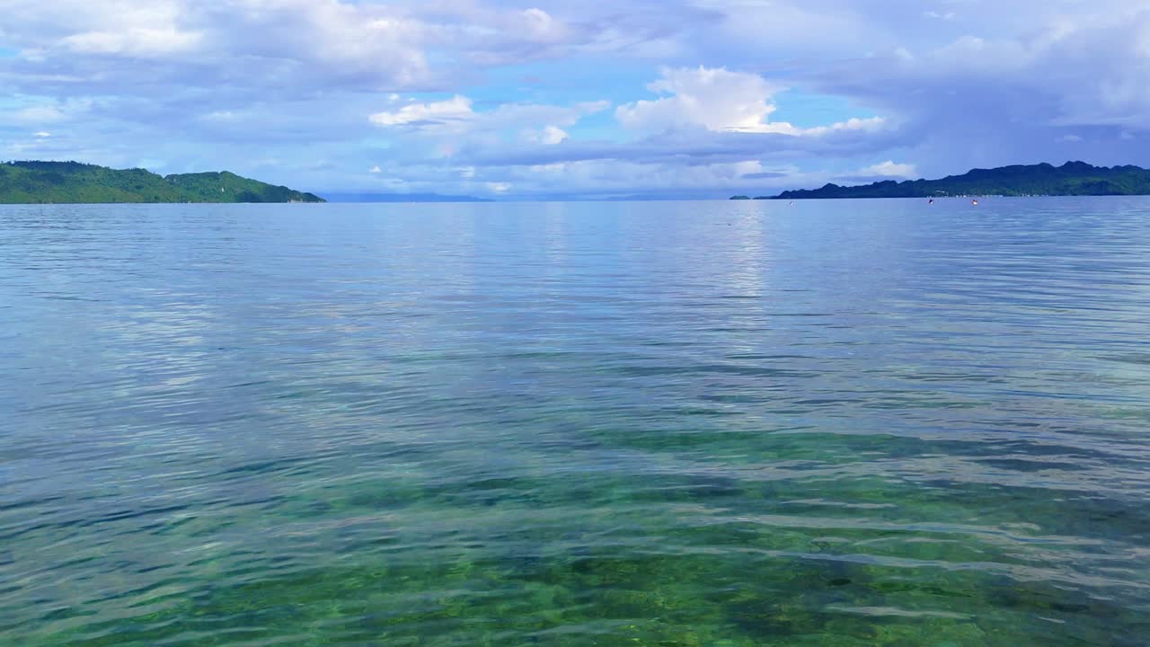 Generic tropical ocean vacation tourism view over tropical waters in the early morning. Dinagat Island Philippines