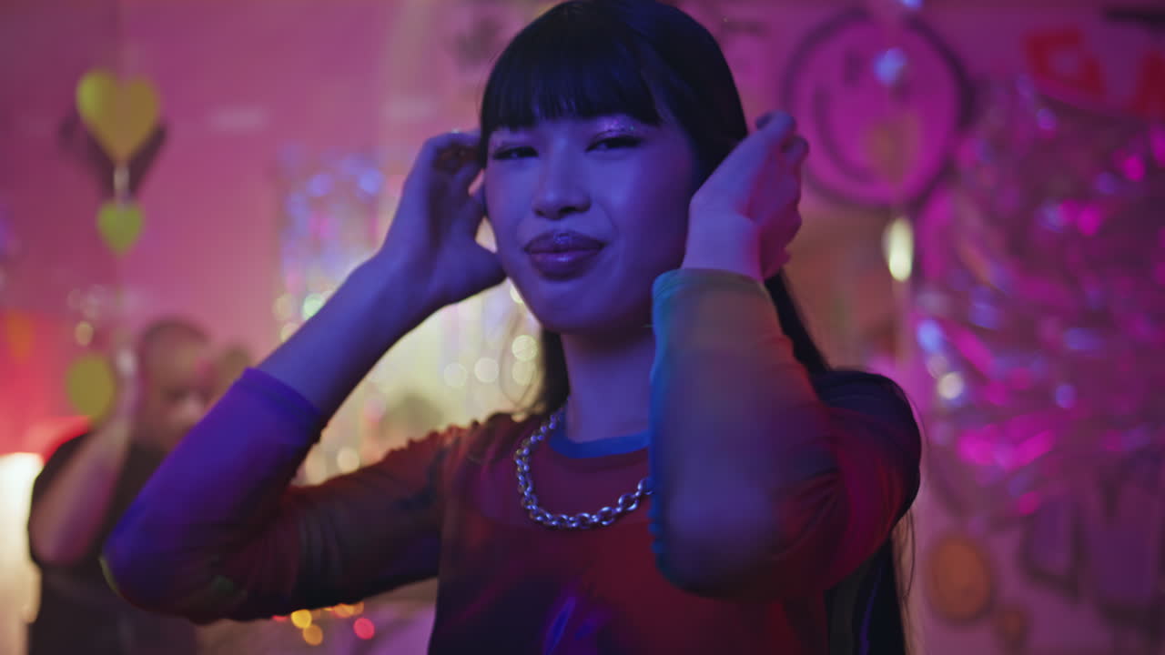 Happy youngsters dancing club party expressing joy closeup. Happy girl