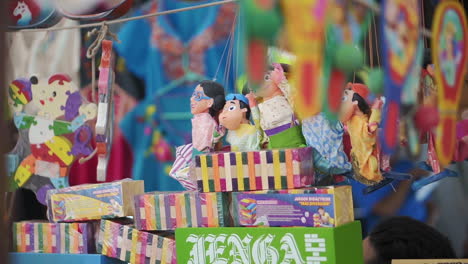 shop of colorful traditional mexican toys for sale at a market