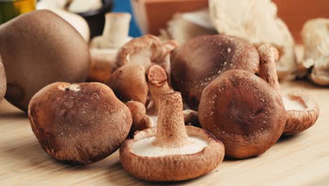 Assortment of Fresh Shiitake Mushrooms on a Wooden Board