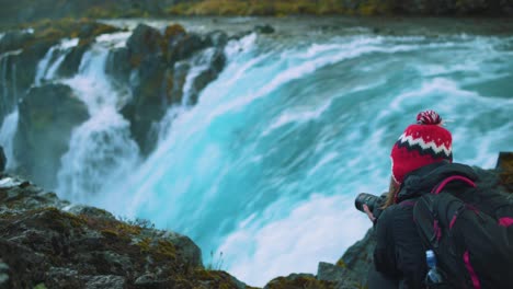 photographer woman at midfoss falls, iceland