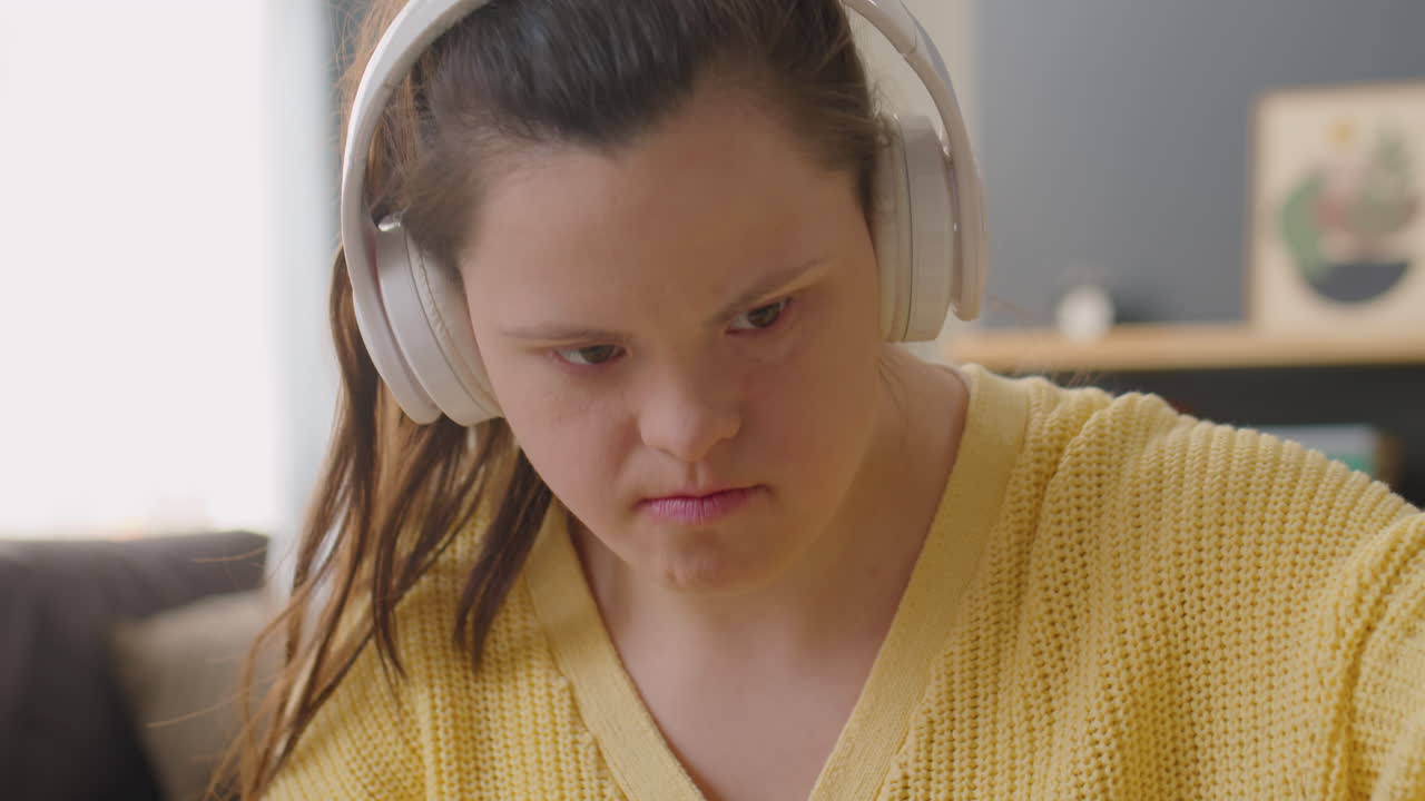 Girl with Down Syndrome Playing Music with Synthesizer