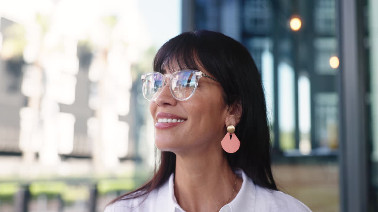 Happy Woman in Glasses Looking Up and Smiling