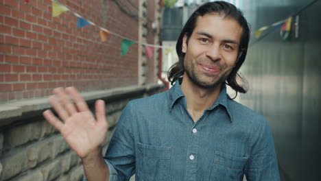 man greeting in an urban alley