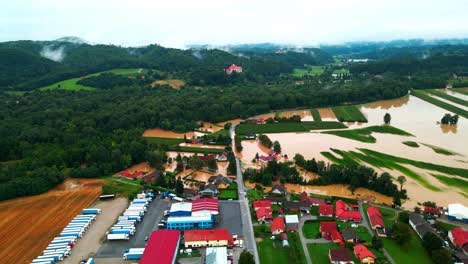 Horrific-Aerial-4K-Drone-footage-of-houses-in-Podravje,-Slovenia,-during-August-floods