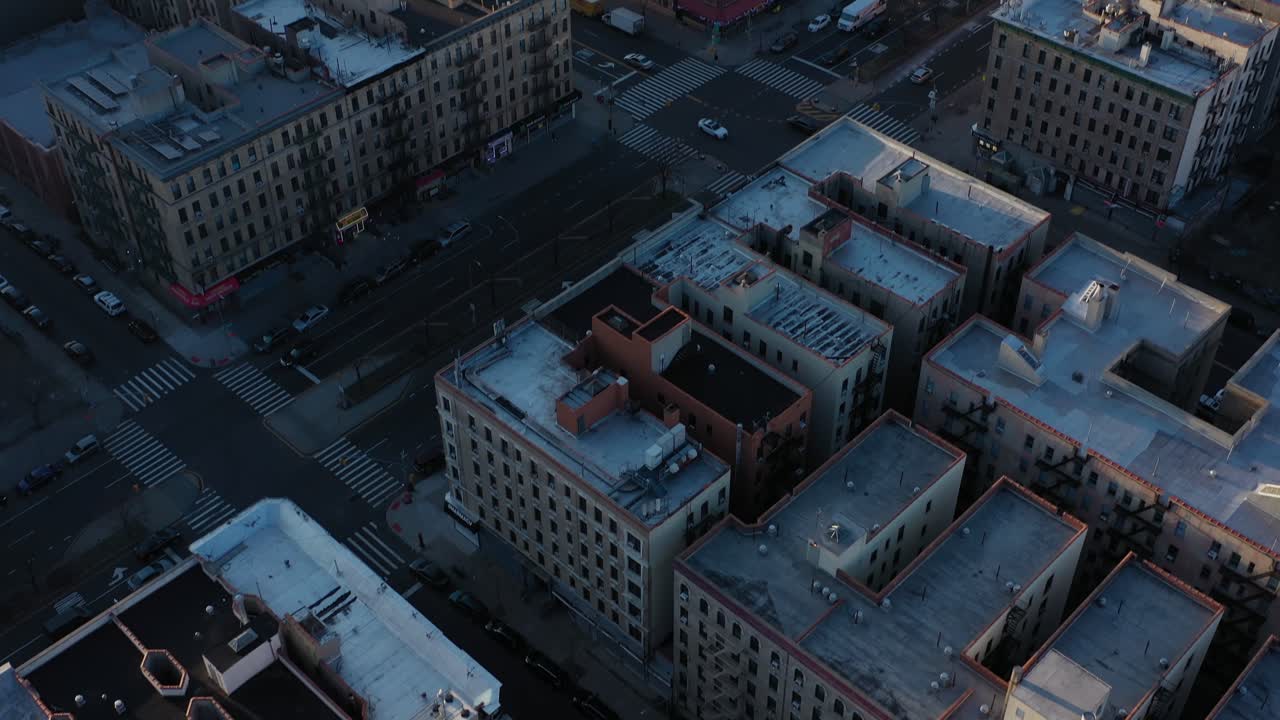 aerial tilt up over the rooftops of upper Harlem New York City on a crisp morning