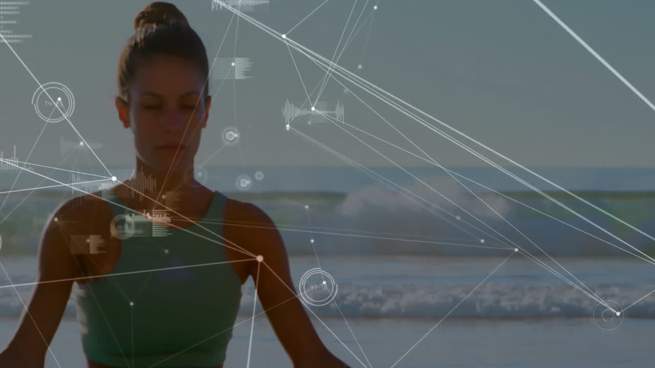 Meditating on beach, woman with data visualization overlay animation in background