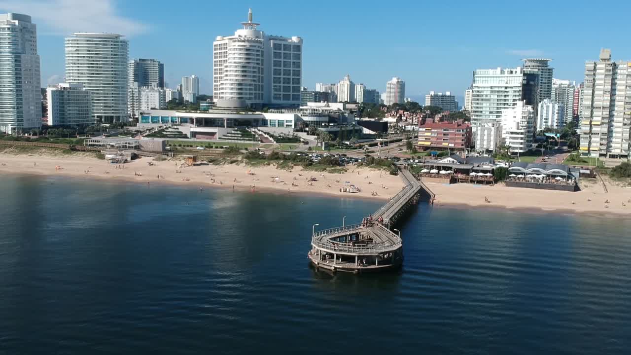 Beautiful Beach Cityscape with Pier and Hotel