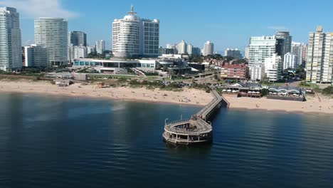 beautiful beach cityscape with pier and hotel