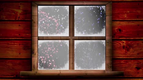 digital animation of wooden window frame against fireworks exploding on winter landscape