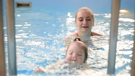 the baby's coming upstairs from the swimming pool helps the mother in slow motion