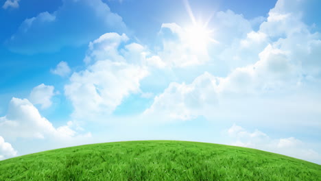sunny green hill under blue sky with clouds