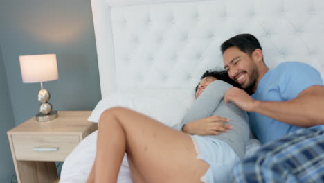 Love,-romance-and-a-playful-couple-on-bed