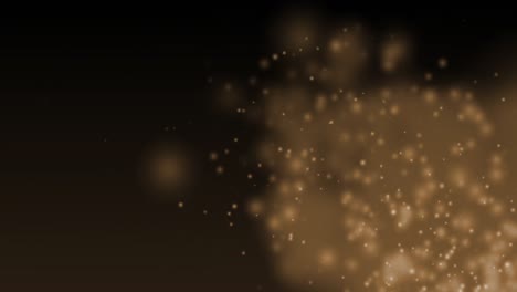 Glowing-brown-particles-effervescing-on-a-dark-background