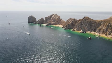 aerial: baja california sur peninsula, view of arch of cabo san lucas, mexico