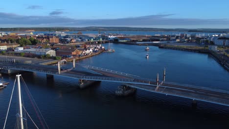 twin sails bridge in poole opening up for boats to sail through3