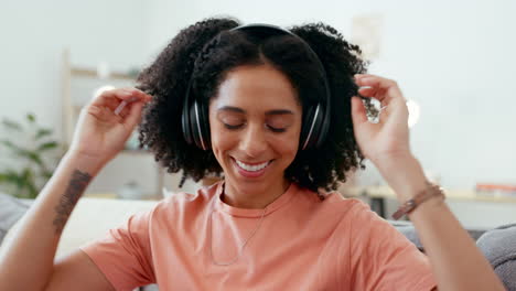 Music-headphones,-dance-and-woman-on-sofa-in-home