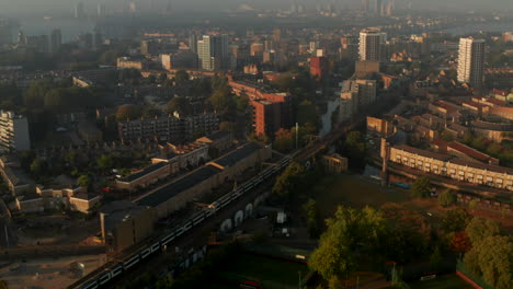 C2C-train-passing-through-Limehouse-East-London-Neighbourhood-golden-hour