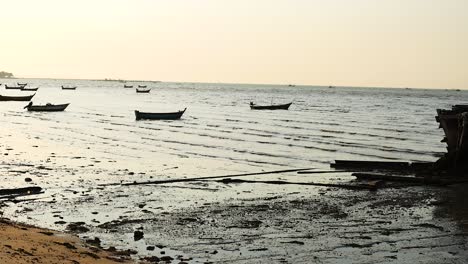 calm sea with boats near chonburi shore