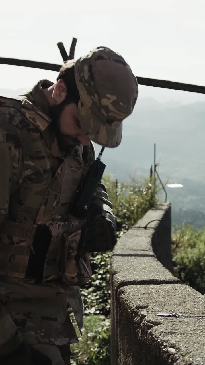 Soldier Adjusts His Gear During A Mission Under The Sun In The Balcony