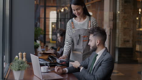 cafe customer paying with credit card